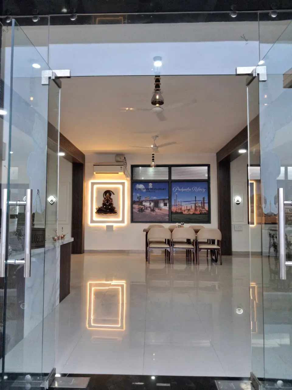 Glass doors opening into the Guru Kripa dining hall