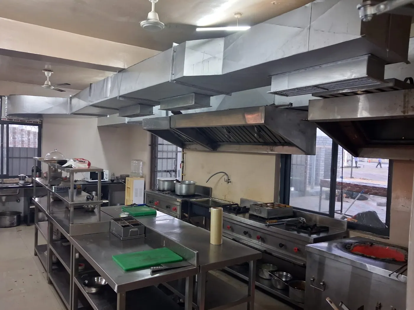 Cooking range and exhaust hoods in the Guru Kripa kitchen