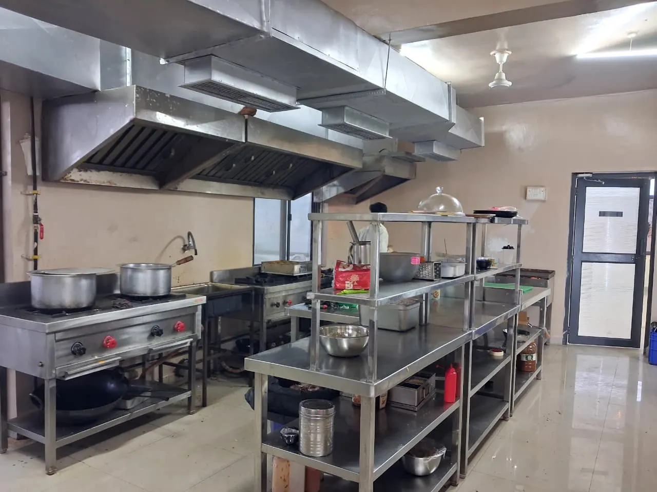 Prep station with steel shelves in the Guru Kripa kitchen